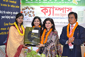 Managing Director and CEO of Green Delta Insurance Company, Farzanah                 Chowdhury is giving Special Gift to the Best Co-leader of the Apprenticeship Program as Chief Guest. Dr. M Helal is presiding over. (2014)